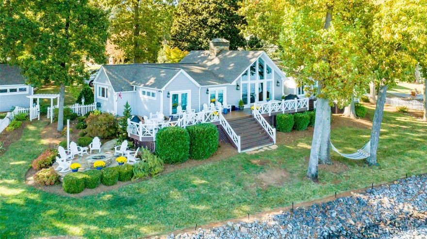 Lake Norman's Sunrise Paradise is now available! Feel like you're on a cruise ship in this stunning luxury home is only 2208 sq ft but offers extraordinary BIG panoramic sunrise views, luxury amenities, & prime location that has a VRBO strong rental record. No HOA, deep water, private pier. The Primary suite features a vaulted ceiling, luxury bath & access to the hot tub. Renovated in 2005 & 2016 this ranch w/loft has tons of natural lighting, soaring beamed ceilings, Thermador appliances, ice machine(Marvel brand) in cocktail lounge, fenced backyard, flat yard with gardens & irrigation, Marble counters, & Brazilian cherry floors.  Septic permit is for 3 bedrooms. Currently using the flex room as a bunk room/office. The huge floor to cathedral ceiling stone fireplace give this home a warm & inviting feeling with vented gas logs. Room for a 2 car garage. New floating dock in 2022. Located near new shopping & restaurants w/quick access to Charlotte. Owner is a licensed Realtor/Broker.