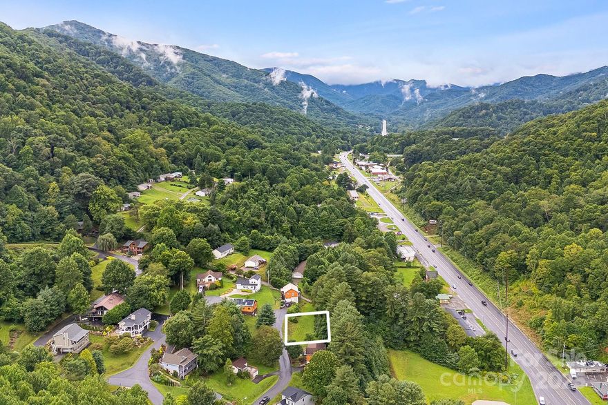 Nestled on a 0.23-acre residential building lot in the Maggie Valley area (with a Waynesville address).  This property sits at the end of a cul-de-sac in the Linson Ridge subdivision—right in the heart of one of Western North Carolina’s most charming mountain resort communities. Conveniently close to shopping, antiquing, hiking, golf, dining, and other mountain attractions.  Wonderful location, only 10 mins from Main St, Waynesville, and minutes from all the shops and restaurants of Maggie Valley.  The lot offers access to city water and sewer, and is located on a paved, municipally maintained street.  It's such a great walking neighborhood.  With its gentle slope, a basement-style foundation is likely ideal.  Note: Minimum 1,200 sq ft home required (see restrictions for details).  This cleared, open lot offers easy viewing of the topography and is ready for your dream home construction.