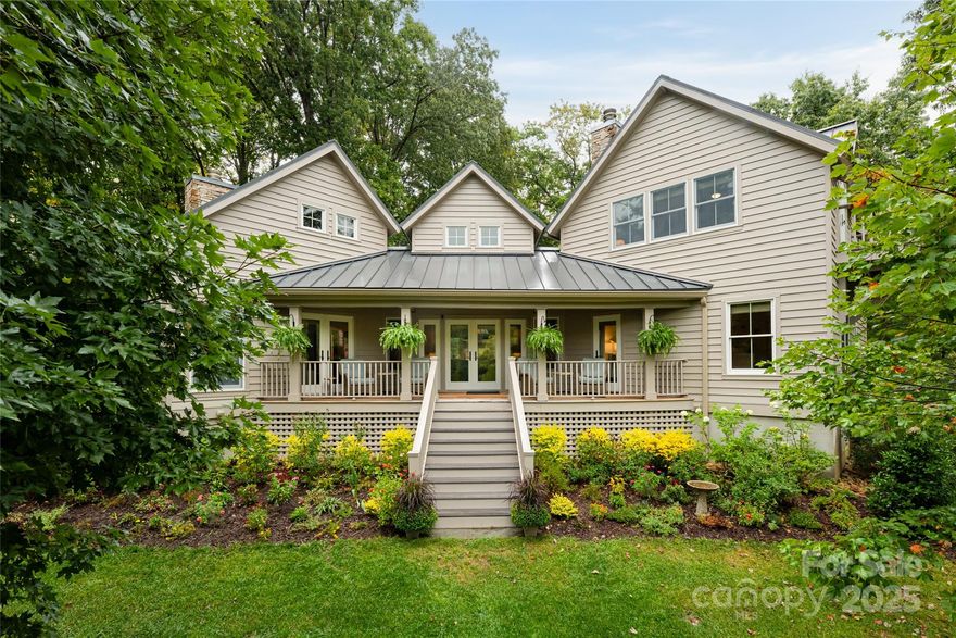 This meticulously crafted home impresses the moment you step inside, completely unscathed by Helene. Originally designed as a builder's personal residence, every detail has been curated to blend light, warmth, and scenic views seamlessly.  This mountain retreat features cedar siding and a durable metal roof. The living room boasts an 18-foot vaulted pine ceiling and striking floor-to-ceiling stone hearth with a woodburning fireplace. The kitchen is a chef's dream with custom cabinetry, an 8-burner Wolf range with double ovens, built-in SubZero refrigerator, and an expansive island. The den offers a second woodburning fireplace and leads to the primary bedroom suite on the main level, featuring walk-in closets, built-in bookcases, a window seat, and access to a covered front porch with a low-maintenance Ipe deck. A breezeway connects to a detached 2.5-car garage with a luxurious upstairs living quarters/office space complete with a kitchenette, bath, vaulted ceilings, and sitting area.