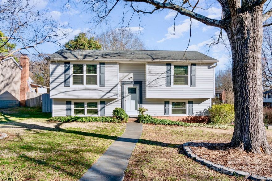 Welcome to your dream home! This stunning 3-bedroom, 2-full-bath split-level residence offers the perfect blend of modern updates and cozy charm. Step into the updated kitchen, where butcher block countertops, a spacious kitchen island, and gleaming stainless-steel appliances create an inviting space for cooking and entertaining. The home boasts updated flooring throughout, complemented by fresh paint that brightens every room. Enjoy outdoor living with a large fenced yard, complete with a privacy fence and an above-ground pool featuring a newer pump and liner—perfect for summer fun. A powered outbuilding adds versatility, ideal for a workshop or extra storage. Relax on the screened-in back porch, a peaceful retreat for any season. Additional upgrades include newer windows, HVAC, and water heater, ensuring comfort and efficiency year-round. With its thoughtful design and meticulous updates, this home is move-in ready and waiting for you to make it your own.