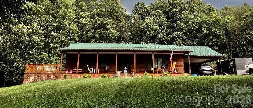 We've all said it as parents, "I wish you would go outside and play!" But Mom.. there's nothing to do outside. This beautiful, sprawling 1.26-acre tract 500+ feet off Jennings Rd offers four separate areas to play basketball in the large parking area, football or soccer in the front yard, the bordering creek with the beach area or the swimming pool off the back deck. The pool, by the way, is optional. The sellers are willing to take it with them and grass over. Take your favorite beverage to the front porch to watch the sun set; to the expansive open deck overlooking the creek or the deck off the dining area at the pool area. If "tinkering" is your way of relaxing head out to the shed. Want a garden? This oversized lot has plenty of room for your vegetable garden. There is a space for everyone!
Inside, you will find a welcoming layout that feels open and airy with the living room featuring tall, vaulted ceilings, while still offering cozy, defined spaces for everyday living. This home offers the perfect balance of manageable size and expansive outdoor lifestyle. The kitchen is tucked out of sight and updated with stainless appliances and granite countertops. The three bedrooms and two baths are located in the private area of the house-complimented with true wood floors in the main areas for style, comfort and easy maintenance. 
This rustic ranch features a metal roof that will lull you to sleep on rainy days and give you a lifetime of protection; the wood siding and its country setting reminds you of a mountain house. The double carport has additional storage and can double as a shaded play area on the warmer summer days.
The sellers have purchased their dream farm, are packed and ready to move. He says, "call Jade or your buyer agent, submit your offer and let's make this happen!"