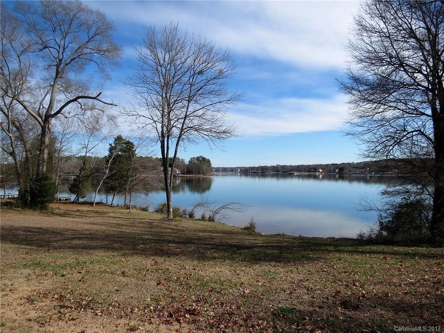 Spectacular views of Lake Wylie from this one acre waterfront lot! The lot already has a dock on it that has recently had some repairs done. The land has a small river cabin on it. There are not too many properties left on Lake Wylie with the "big water" views that this lot has. The lot sits at the end of a county maintained road in a quiet private neighborhood with no HOA. If you are looking to build on the lake this is your dream location.