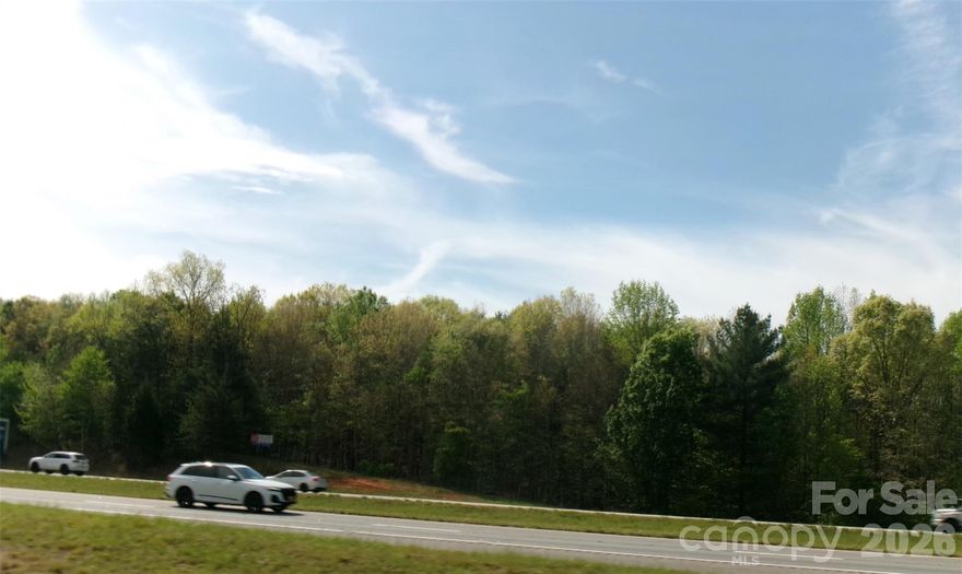 3 parcels of vacant land totaling 25.51+- acres. Located on the East bound side of interstate 40 just west of Hickory, NC at exit 121. This property has great exposure to I-40 with over 1500 feet of frontage. It is accessed just off I-40 Exit 121 to the South on Old Shelby Road. There are 2 access points, Oglesby Lane and a second access, 1887 Old Shelby road which is a .67 acre lot currently zoned R-1. A 3rd lot of 5.31 acres is currently zoned R-1 and does not touch the other 2 lots. There are power lines on this parcel.
