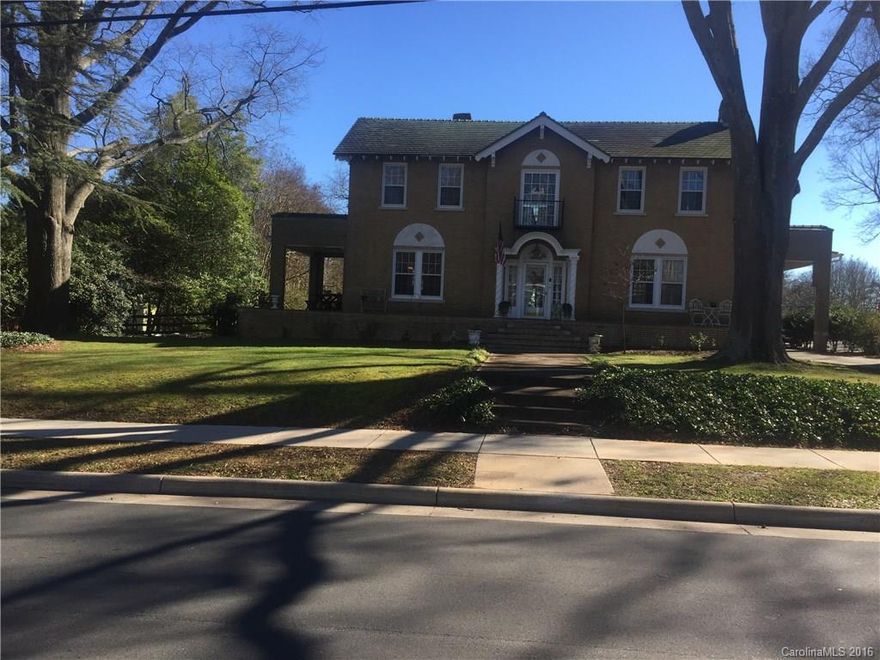 Beautiful Georgian home, built in 1929, and designated by N.C. Department of Cultural Resources as an historic landmark. Gorgeous entrance, foyer, and winding stairwell. Lovingly restored original windows, 2014 kitchen renovation with granite tops and ss appliances. Attractive breakfast nook and butler pantry. Formal dining room and lots of spacious rooms. Five blocks from the center of downtown in the middle of the historic district. Large fenced in back yard.