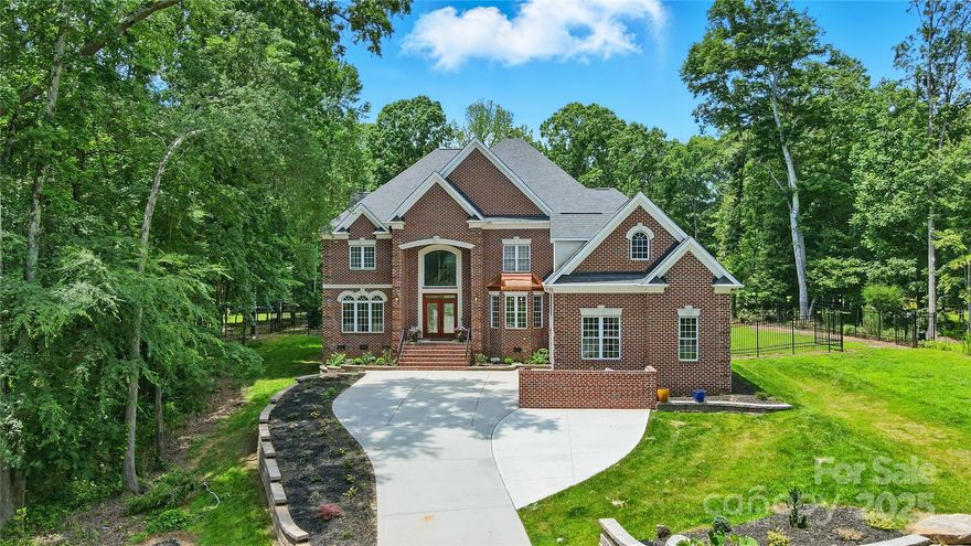 Don't miss this out on this beautifully updated WEDDINGTON Home w/full brick on 1.04 acres offering space, style, & sought after schools! Situated on a flat, private, & fully fenced backyard, this home is perfect for everyday living & entertaining alike. Step inside to discover an open, airy floor plan w/brand-new white oak hardwood floors throughout. The dramatic 2-story family room is filled w/natural light & anchored by a striking curved staircase, creating a grand first impression. Main level includes: Private Office/Guest suite w/attached 1/2 bath, formal Living & Dining, Butler’s pantry w/wine cooler, dual staircases, Kitchen w/granite counters, walk-in scullery w/additonal stove & refrigerator for home bakers & chefs. Upstairs w/large Primary suite w/separate sitting area, plus three additional bedrooms, Bonus rm, & an open Loft offering flexible living spaces. Fully fenced, level backyard, new Trex deck, Screened porch, new roof & interior paint throughout! Hurry on this one!