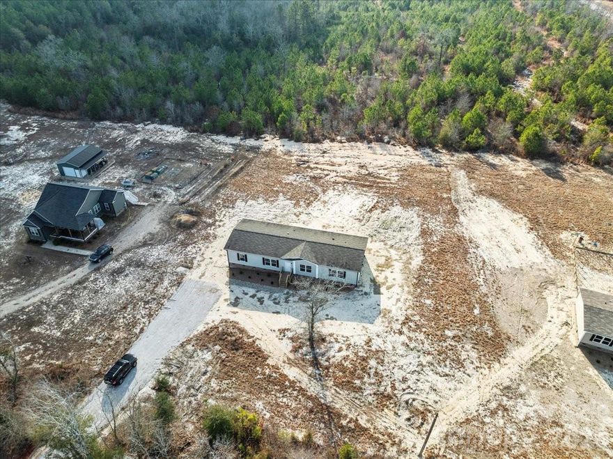 Charming Country Living on 1+ Acre — 3 Bedroom, 2 Bath Home with Second Family Room!
Welcome to 5257 Raleys Mill Road, a spacious and inviting 3-bed, 2-bath home ideally situated on a 1.06-acre parcel in peaceful Bethune, SC. Boasting approximately 1,920 sq ft of living space, this well-designed residence features a desirable split bedroom floor plan that offers privacy and comfort for all.  Updated with new stove, refrigerator and dishwasher.  Has new heat pump and furnace.  Brand new flooring, ceiling fans and toilets.  New brick skirting with composite decking.  Fresh paint throughout. Step inside to a bright and open layout with plenty of room for everyday living and entertaining. A second family room provides flexible space — perfect for a home office, playroom, media room, or formal living area. The generous kitchen serves as the heart of the home and flows easily into adjacent living spaces.
The primary suite is tucked away for added privacy and includes an ensuite bath, while two additional bedrooms and a second full bath complete the thoughtful floor plan. Outside, enjoy peaceful country living with ample yard space on over an acre — perfect for gardening, outdoor activities, or future expansion.
Conveniently located near schools, local amenities, and scenic rural roads, this property offers the perfect combination of space, comfort, and Southern charm.
Don’t miss your chance to make this lovely home your own!