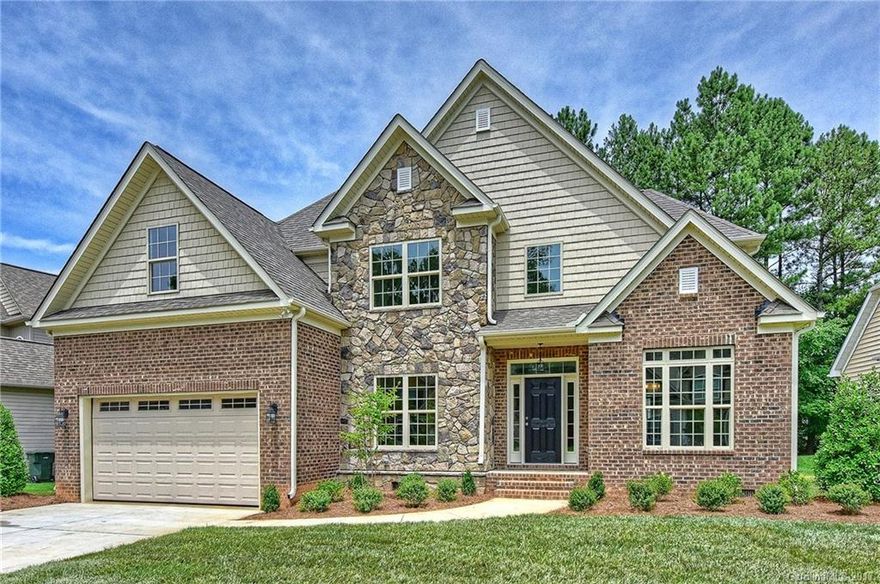 Dramatic wood staircase with iron baluster welcome you into the elegant foyer.  Enjoy this chefs kitchen with 42" upper cabinets, granite countertops, gas range/electric oven with gleaming subway backsplash.  Site finished hardwood flooring.  Master on main with tray ceiling, wood flooring. Enjoy entertaining in the spacious great room with two-story ceiling and cozy gas fireplace.  Second bedroom with full bath on main or use as an office.  Two bedrooms, bonus and office up. Easy access to I-77