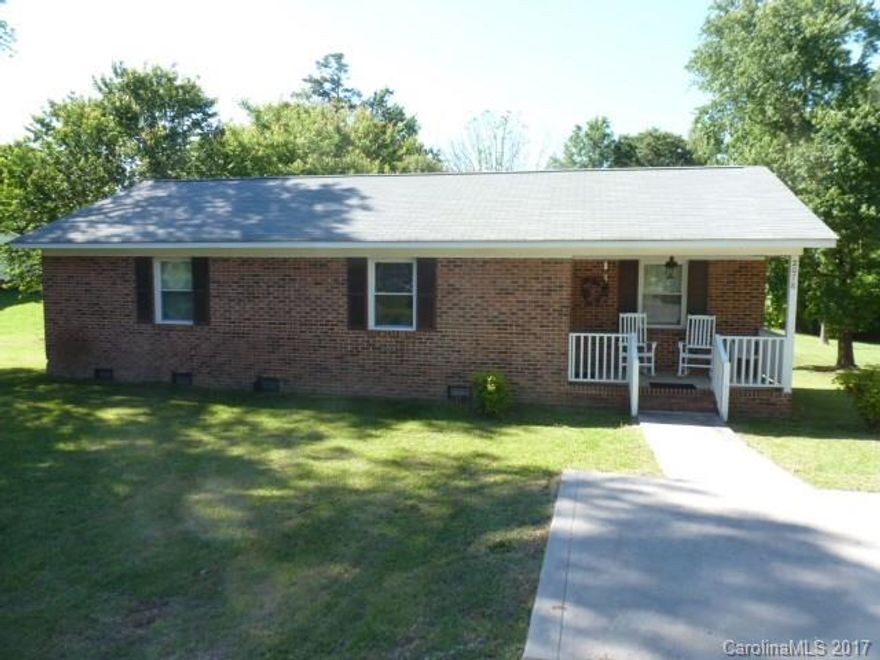 Neat and clean, this all brick 3BR, 1.5BA home could be yours. On a half acre lot with paved driveway. Living room, kitchen with breakfast area, nice size bedrooms, great screened porch on back. Appliances include stove, and refrigerator. Laminate floors. Make your appointment to view today!