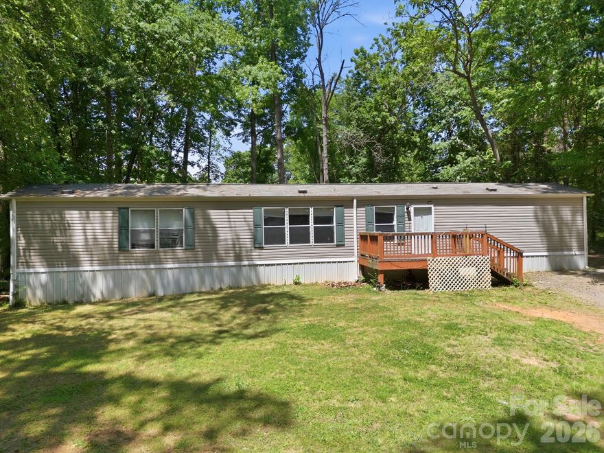 Move in ready 3 bed/2 bath manufactured home offers the perfect blend of space and peace of mind. Situated on a private, large lot, it features several high-ticket updates. NEW ROOF (2025) and newer HVAC system in last few years. The heart of the home is an open concept living area and a spacious kitchen designed for hosting or easy daily living. The layout follows a smart split-bedroom plan for maximum privacy. Primary Suite, a quiet retreat on one side of the home featuring a large ensuite bathroom, complete with a garden tub and a separate shower. Two additional bedrooms are located on the opposite side sharing a full hall bath. Enjoy the quiet of your own land without sacrificing convenience. You’re just a short distance from local dining, shopping, and everyday essentials.