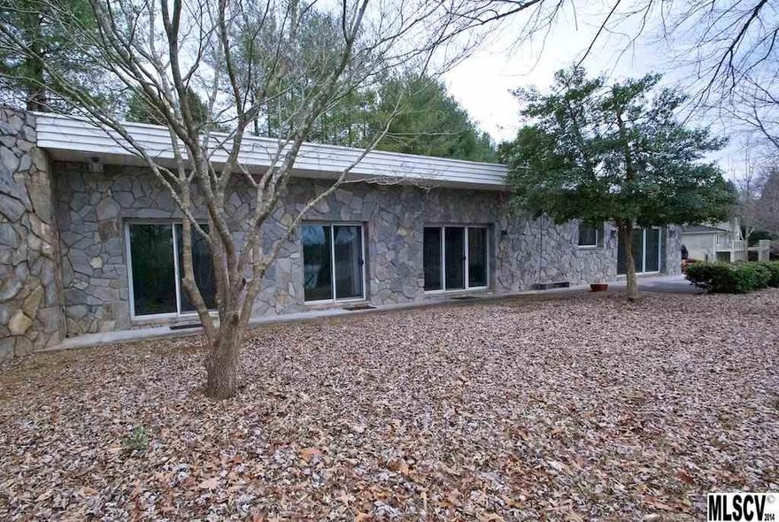 Amazing & Unique Lake Hickory home offers panoramic views of the lake and mountains with approximately 2 acres and 275’ of waterfront. Lot’s of lakefront living to enjoy in this custom-built one level home. Take pleasure in the water views from every room or while relaxing on the patio or lounging on the lawn by the lake. This home features a living room with fireplace, and built in bookcases.  Spacious kitchen boasts abundant cabinetry, sunny breakfast area, and open to living area. Master suite on the main level with a walk-in closet, tub-shower. Walk-in laundry. Double garage with half bath.