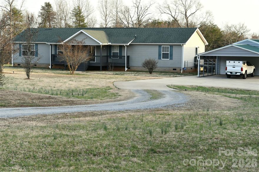 This is now a pre-foreclosure Short Sale which will require lender approval. Bring your horses/animals & dreams! Wonderful home on private 16-acre property with so many potential uses. Great set-up for a gentleman’s farm. Approximately 14 acres w/new 4’ high livestock perimeter fencing in 2025. There is plenty of cleared land w/established grass suitable for pasture, gardening, or addition of outbuildings. Wooded portion of land has established 4-wheeler & hiking trails, small stream, and is very walkable. The large modern 3BR/2BA home is in excellent condition and features 2 living areas & split bedroom floor plan, giving everyone enough space! Front entry foyer w/arched doorway to living room. Separate dining room w/sliding glass doors to covered back porch. Large kitchen w/great cabinet & counter space, center work island, upgraded appliances, and arched doorways opens into multi-purpose family room. Side entry foyer. Separate laundry room w/newer washer & dryer. Primary bathroom w/soaking tub & separate shower. Recently painted interior. There is a whole-house generator hookup. Owners have high-speed fiber optic internet service through Spectrum. Exterior features include freshly painted covered front porch, 550 sq.ft. detached insulated garage w/2-car attached carport, unique tractor-trailer repurposed as a storage building w/electricity & a large lean to on each side (concrete patio area under part of back lean to), 12x20 storage shed, chicken coop, fruit trees, and expanded concrete drive w/additional parking space. Septic tank was recently pumped. This is a special property that is well worth your consideration. Property was previously approved for a dog camp site through Cleveland County Department of Planning & Zoning in 2025. Call for details.