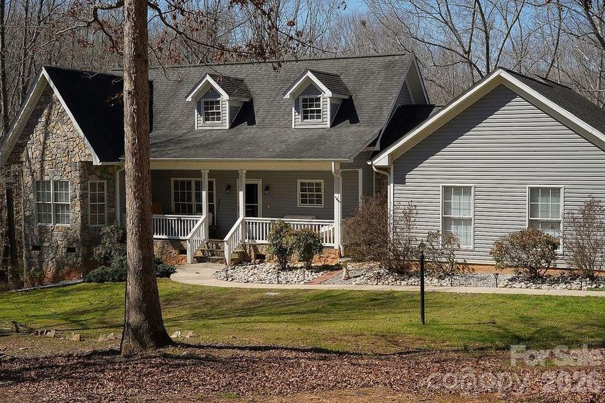 PRICE IMPROVEMENT: Inviting open ranch plan with a smart split-bedroom layout and handicap-accessible doorways throughout. Two bedrooms and a full bath are on one side of the home, with the laundry room and private primary suite on the other. The bright, open kitchen offers stainless steel appliances and great space for entertaining, flowing into the living room with surround sound, which also extends to the front porch and rear deck for seamless indoor-outdoor enjoyment. Enjoy peaceful mornings with a cup of coffee on the front porch, set well back from the street for added privacy and tranquility, and a rear deck overlooking a private wooded lot. An oversized 2-car garage and a convenient walk-in crawl space complete this charming home that blends style, functionality, and modern comfort.