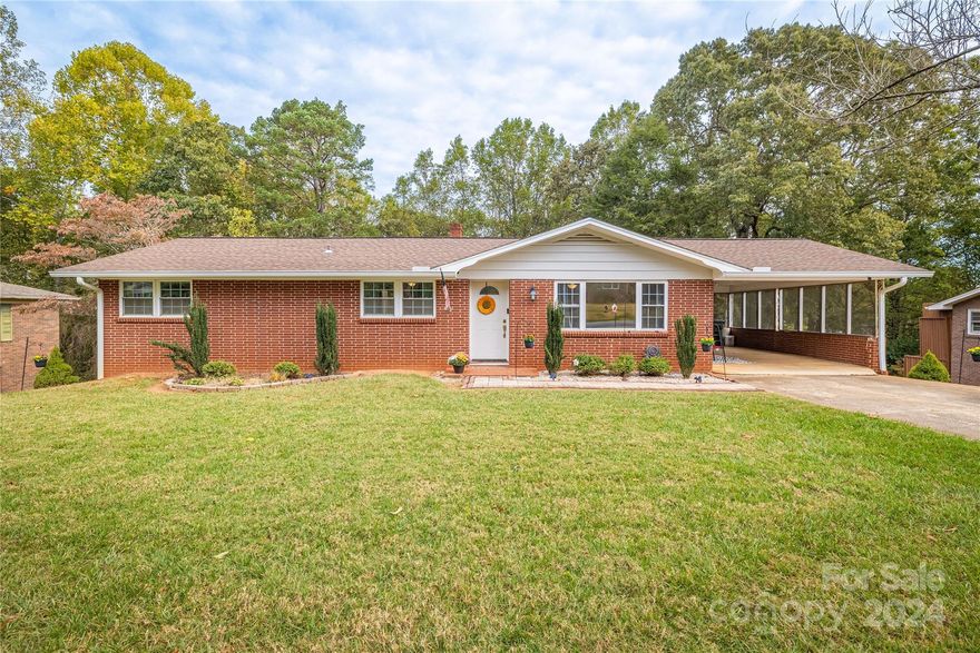 Attention  Hickory! Dead End Street! Creek in Back Yard! This charming 3 bedroom 1.5 bath brick ranch is just impatiently waiting for its new family! Close to Lenoir Rhyne University. From the inviting eat in kitchen with stainless steel appliances to living room with all its natural light you cannot go wrong with this home. The large primary bedroom is complimented with an updated half bath. Downstairs in the basement there is a sizeable rec room with a gas log fireplace. The garage has a large room that is plumbed with a half bath. Don't let this one slip away.