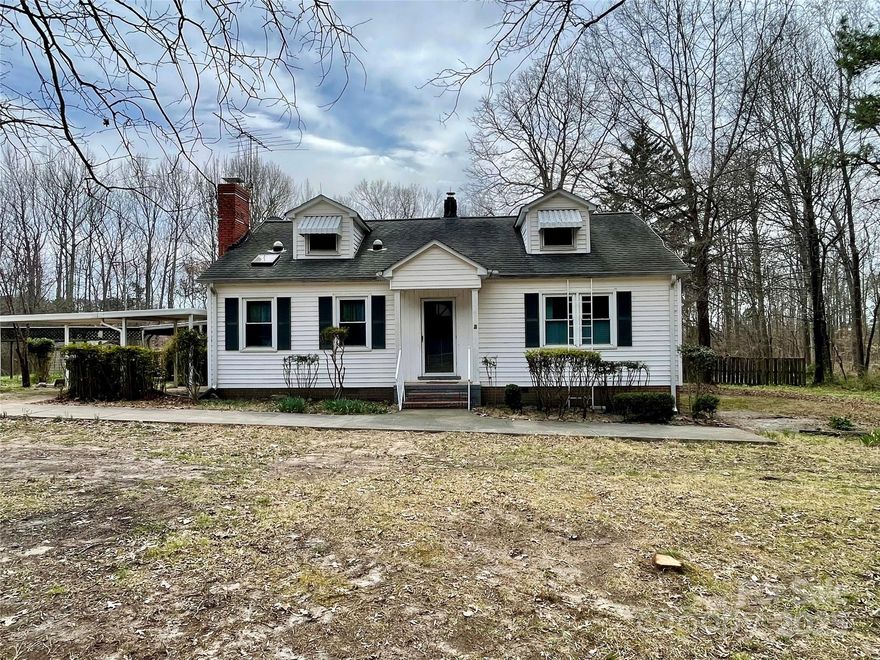 !!! HIGHLY MOTIVATED SELLER. 20 MINUTES FROM UPTOWN CHARLOTTE  CLOSE TO I-485 and I-77 
Charming Cape Cod Home on Spacious 1.6 Acres (survey in pictures) in Huntersville. SELLER SAYS SUBMIT ALL OFFERS! LOCATION LOCATION LOCATION!

Welcome to your dream home in the heart of Huntersville! This delightful 1946 Cape Cod-style home offers a unique blend of vintage charm and modern potential. Situated on a generous 1.6-acre lot that backs up to a serene 30-acre tree farm, this property provides both privacy and tranquility.

The home features 1,534 square feet of living space, with a cozy and inviting atmosphere. Enjoy the expansive, beautiful yard perfect for outdoor activities and gardening. Additionally, a large outbuilding with four bays offers ample space for storage, workshops, or hobby projects.

This property has a ton of potential,  offering a fantastic opportunity for customization and personalization. NEW A/C Unit.
