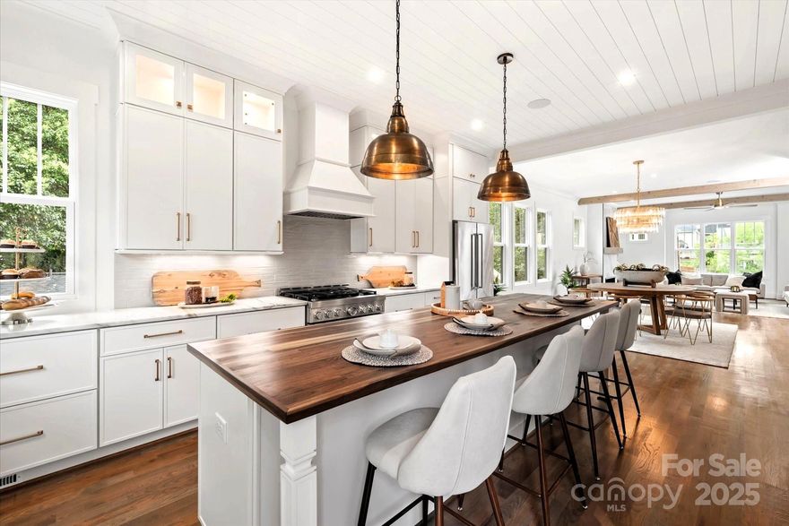 Welcome to this luxurious duet in the highly sought after Plaza-Midwood! Filled with natural light, the open concept plan is perfect for entertaining, with a spacious living room that opens up to a large kitchen and large deck. Primary suite features customizable walk-in closet & primary bath with soaking tub.  Top level entertainment bonus room has a bar area, ½ bath, and opens to a 200 SF terrace.  Gourmet kitchen with custom cabinetry, marble/walnut countertops, huge island, KitchenAid appliances, and under cabinet lighting. All BDRS with walk-in closets, spray foam insulation at roofline, and surround system/speakers in family room, kitchen, primary, bonus room and terrace.  CAT 6 wiring, walk-in pantry, bar area in bonus room, high-end fixtures throughout, 4 separate AC zones, fenced-in backyard, Rinnai+ circulating lines, HW floors throughout, and 10 ft ceiling on main living floor.  Walk to literally everything - bars, restaurants, shops, parks, grocery, salons, and more.