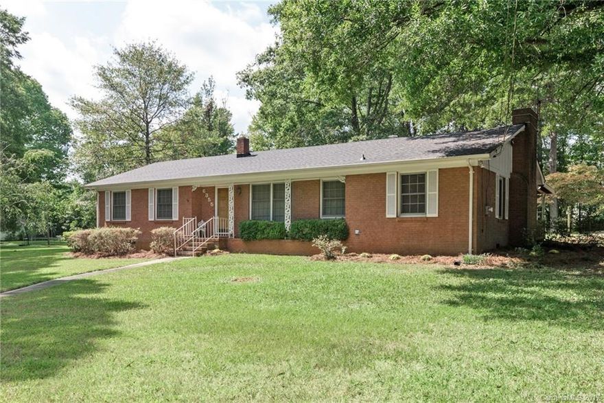 FULL BRICK Home nestled among the trees on OVER AN ACRE corner lot! Magnolia and Dogwood trees abound. No HOA. 2 lots included in the sale. Possibility of orig. hardwood floors under carpet in the living areas. Large kitchen open to cozy den with gas log fireplace. Appreciate the vintage style, update it, flip it, or build a house on it...lots of possibilities! New Roof in 2017, HVAC replaced in 2009. Spacious covered back patio to enjoy the expansive view. Huge concrete pad for 4+ cars, Hurry!