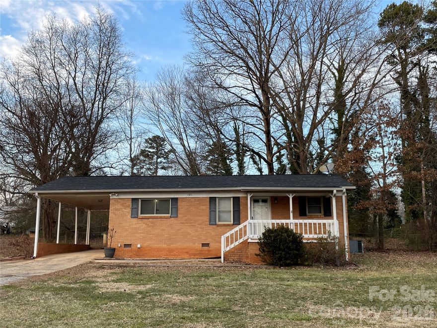 Classic charm meets modern comfort. From the moment you arrive, the rocking chair front porch invites you to slow down and enjoy this brick ranch with carport. Features timeless hardwood floors in both bedrooms and the dining area. Lots of updates you’ll also appreciate coming home to include the following: opened up the kitchen to the living room to improve flow for entertainment and daily living. Kitchen updates include kitchen cabinets, tiled backplash, counter tops, sink, faucet, and appliances (refrigerator remains), as well as the flooring in the kitchen, living room and bath. But wait, there’s more! Added new architectural roof (2021), and replaced the old fuse box with a modern breaker panel (2023). In addition to all of those updates, owners also replaced the bath vanity, the garden doors to the deck, as well as the deck top boards overlooking the fenced back yard where there’s a large wired storage building with an enclosed ground level shed on the rear for lawn and garden equipment. All of this country living with private well and septic (meaning no city utilities), and added financial benefit of no city taxes. Near Stanley, but with a Dallas mailing address. Come on home!