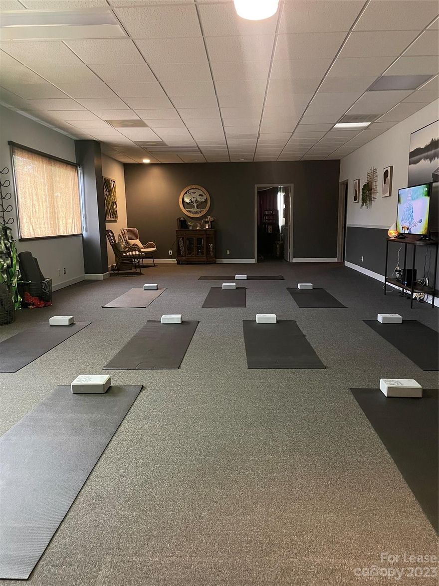 Beautiful upstairs suite of over 2600 square feet of prime office/spa space on a busy street with road frontage and lots of traffic driving by daily. 
Currently being used as a wellness center, but the possibilities are endless! Large open space with 3 smaller rooms/offices, a bathroom and a fully equipped gym with Nautilus equipment. A must see!

Wellness amenities (other than gym equipment) not included but negotiable for sale or rent