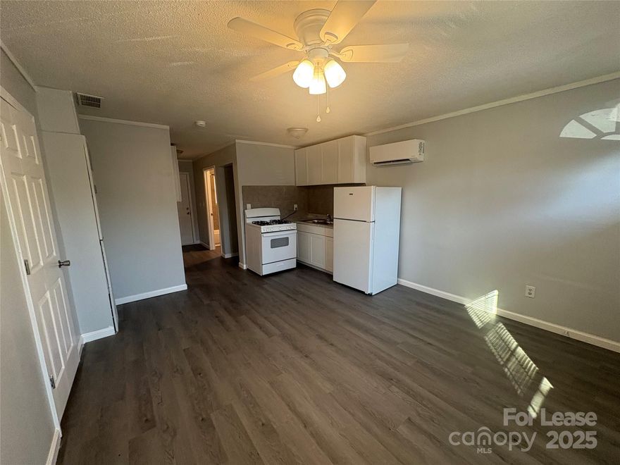 End unit Apartment - Freshly painted and new Vinyl Plank Flooring through out! Cozy 2 Bedroom, 1 Bath This unit has open living area with kitchen area and family area. Two private bedrooms with Large closets and Full bath in the Hallway. Home has gas water heater, Mini Split System for Air and Heat. Don't miss out on this cute unit! Convenient to shopping and restaurants. Pets are conditional and must be approved.