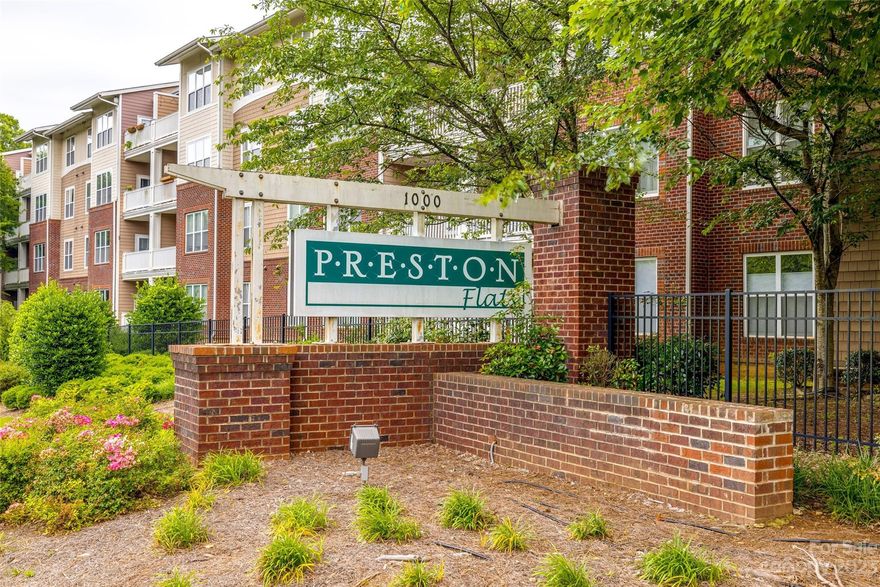 This fantastic turnkey condo is located within the gated community, Preston Flats. The location is prime, just minutes away from Park Road Shopping Center, South Park Mall, Montford, South End, 2 light rail stops within 1 mile and Uptown! The home offers an open concept, split bedroom floor plan, beautiful hardwoods and tile flooring, 42" maple cabinets, breakfast bar and appliances. You'll enjoy the unique, massive balcony off the great room facing the pool and wooded area beyond. Top floor and no adjacent neighbors; so private and quiet. Light, bright, and move-in ready!! Preston Flats is a gated community offering an in-ground pool, dog park and even covered parking. Very secure neighborhood. Welcome Home!! New water heater installed July 2023.