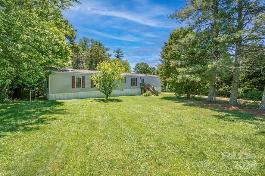 Beautiful private lot close to town. This home is a 3/2 2007 model singlewide with open living space, hidden laundry room, and large primary bedroom. Great home for a family starting out or slowing down, new back deck, outside storage building, and creek at the back with lots of room to garden or run around. Dont miss out on this lovely home.