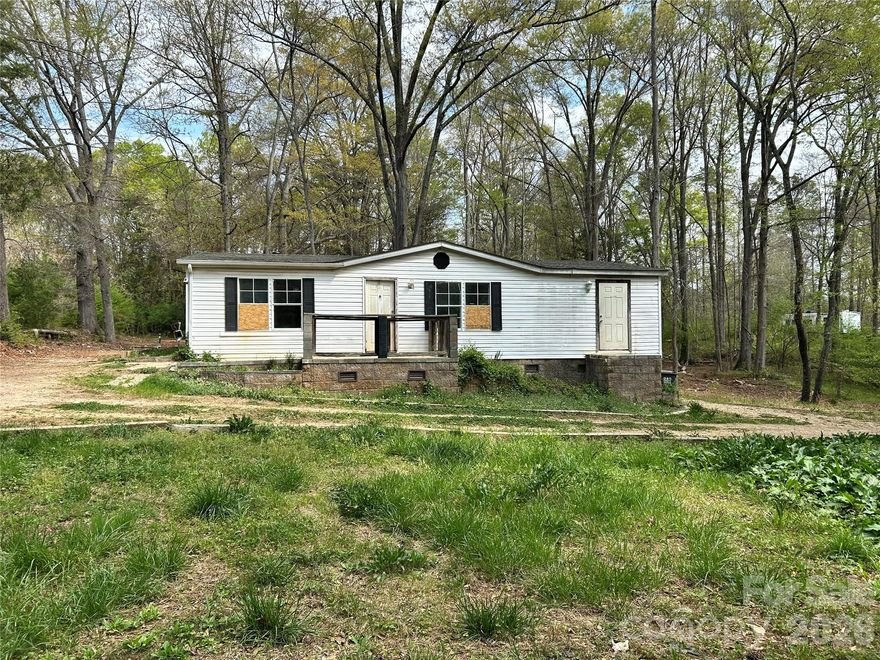 Investor Special. 1996 manufactured home on 1.5 acres. Partially wooded lot. Close to state line just off Hwy 321 in Gateway Farms subdivision. No HOA. Needs full renovation. No HVAC system. Well pump has been removed. DMV title is not retired. Cash buyers only please.