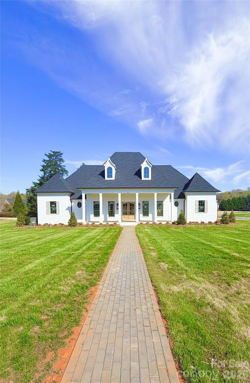 Beautiful French country painted brick ranch on large level Lot. 12’ and 10’ ceilings, hardwoods throughout, custom built cabinetry, wonderful out door living space. Home will be completed in 30 days buyers can still select finishes.