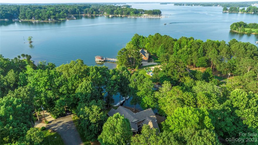 You will fall in love with this gorgeous 4 bedroom/5 bath waterfront home the moment you walk through the door. Inviting open floor plan that is perfect for entertaining. Nestled on a half acre of land in a private cove that opens up to the main channel for a day of fun on beautiful Lake Norman. NO HOA, and a great investment opportunity for a future VRBO. This community provides a private and secured boat launch area. The main level features a formal dining area with trey ceiling, living room with gas fireplace, private primary bedroom with luxury bath and a private guest suite. The lower level walkout basement is an absolute entertainers delight with a wet bar that opens to the family room and recreation area. 2 large storage areas. 2 car garage with half bath. Walkout to the patio to enjoy tranquil views of the lake or just hop on your boat or jet ski's for a day of fun. Easy commute to Charlotte Douglas International Airport, shopping, dining, area schools and golf courses.