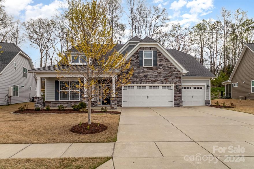 Highly sought after 55+ community, the Villas at Covington, just minutes from Ballantyne! Thoughtfully designed open & spacious floor plan. This gorgeous home boasts 3133 sq ft with 3 Bed, 3 Bath, study and a bonus room. Gourmet kitchen features upgraded GE Profile appliances, beautiful cabinets, walk-in pantry, and an extra-large center island that opens to the great room, perfect for entertaining. Primary suite with trey ceiling and en suite with large walk-in glass/ ceramic tile shower, dual vanities, and large walk in closet and secondary bedroom and a full bath are available on the main. Upstairs, you will find another large bedroom suite, full bathroom, bonus room, & finished walk-in storage room. Large screened porch overlooking the landscaped berm with wooded backyard, stone paver patio, and 3-car front entry garage complete this wonderful home! Truly one-of-a-kind home loaded with upgrades. The community offers an outdoor pool and clubhouse. Lawn maintenance is covered by HOA.