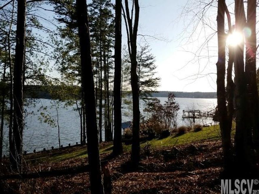 Includes a sea wall and offers huge main channel views east to west.  South facing homesite for passive solar and gentle slope.  Perfect for a retirement lakefront home in the foothills of NC!  Plantation Pointe Amenities: • Heavily Landscaped Illuminated Entrance • Electronic Security Gate • Paved roads • Lantern-lit streets  • Underground utilities  • Community Boat Slips with outdoor grill • Secure Boat Storage Area