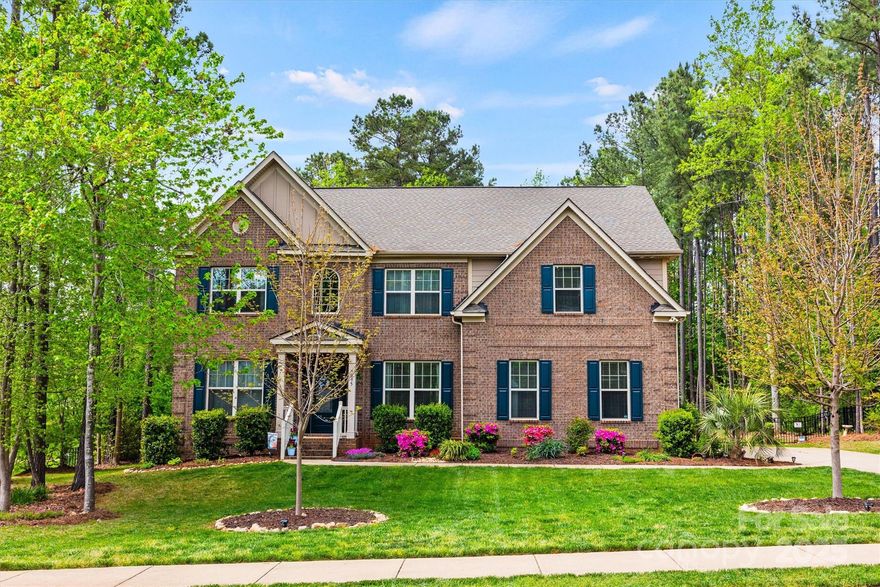 Prepare to fall in love with this beautiful home in The Bluffs!! Located on a 0.8 acre fully fenced, level, private lot with beautiful landscaping, you will fall in love with this all-brick 5 bedroom home! The main floor features an open floorplan with a formal dining room, a living room/office, an oversized great room with coffered ceilings and a gas fireplace, a bedroom with a full bathroom, a sunny breakfast nook and a gourmet kitchen with tons of cabinet and counter space. Upstairs you will find a spacious primary suite, three more spacious bedrooms and a bonus room that is perfect for relaxing or entertaining. There is tons of storage space throughout w/ large closets and a storage shed in the backyard. The dishwasher, microwave and electric cooktop are all less than 2 years old. The long driveway and side load garage provide ample parking.  Low Lake Wylie taxes, Clover Schools, and easy access to local marinas, shopping, restaurants, walking trails and the Charlotte Airport.