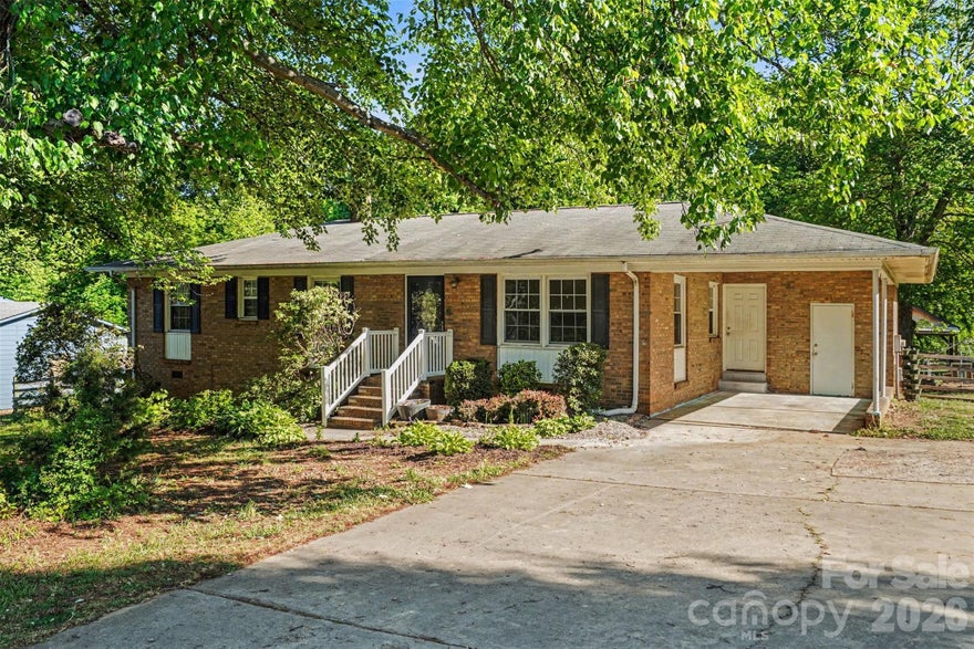 Charming all-brick ranch home nestled in a desirable Mooresville location on nearly half an acre! This well-maintained 3-bedroom, 2-bath property offers hardwood floors and a functional layout. The updated kitchen features butcher block countertops, stainless steel appliances, ample cabinet space, and a layout that opens comfortably to the main living areas, ideal for both daily use and entertaining. The primary suite includes a private en-suite bath, while two additional bedrooms provide flexibility for family, guests, or a home office. Lots of natural lighting throughout the home! From the breakfast area, step out onto the deck and enjoy a large, fully fenced backyard with plenty of room for entertaining, pets, gardening, or simply relaxing. Shed with covered area, previously used for boat storage. Conveniently located just minutes from shopping, dining, and top-rated schools, this home also offers easy access to Lake Norman. No HOA! Enjoy the perfect combination of charm and accessibility in one of Mooresville’s most sought-after areas.