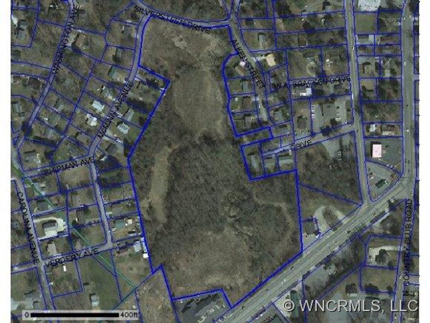 Inside city limits - 12.14 +/- acres with frontage on Rosman Highway, McMinn Street, and Silversteen. Majority of property is in flood plain. Great location!