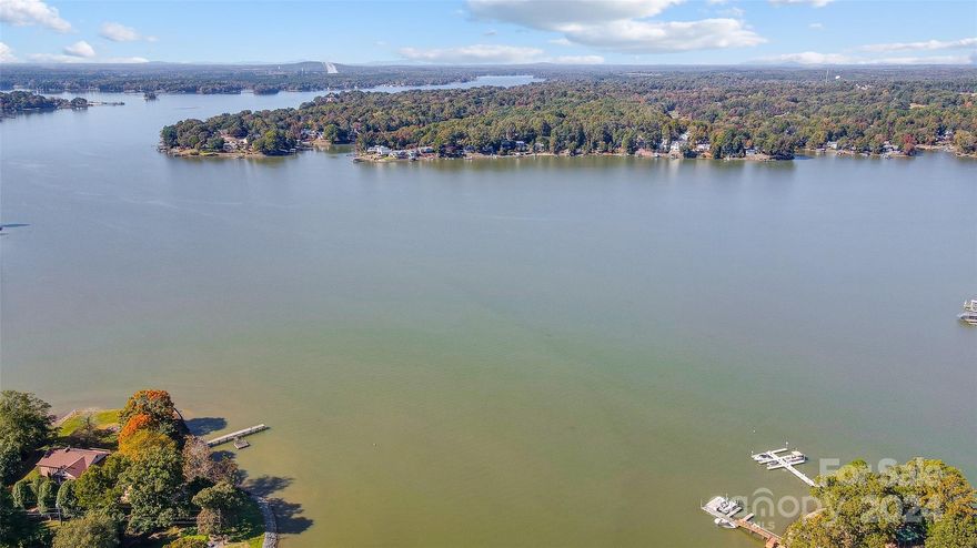 Escape to your waterfront retreat nestled on a gently sloping 1 acre lot. Enjoy the tranquility of this protected cove, surrounded by beautiful hardwood trees and offering ample space for outdoor activities. Spend your days boating, fishing, swimming, or simply relaxing on your floating dock. This property is ideal for a weekend getaway or full-time living, offering a manufactured home with an open great room/kitchen, two bedrooms, two bathrooms, and stunning lake vistas. The home can be enjoyed as is or updated/build when ready. Benefit from South Carolina taxes, no HOA fees, and convenient access to restaurants and shopping. Seize this opportunity to own your own piece of Lake Wylie paradise.