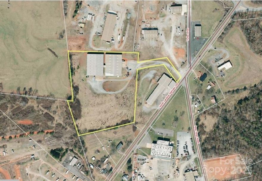 TWOL BUILIDINGS APPROXIMATELY 30,000 SF EACH AND CONNECTED TO EACH TO EACH OTHER BY APPROX 400 SF FOR TOTAL OF APPROX 60,400 SF.  Connecting construction is approx 8 ft high ceiling.  EACH BUIDING HAS SIX DOCKS. CEILING HEIGHT AT EDGE IS 20 FT; AT EAVES 26 FT. SUSPENDED PROPANE HEATERS; PUBLIC WATER, SEPTIC. ORIGINAL BUILDING BUILT IN 1991; SECOND BUILDING ADDED IN 2000.3 PHASE POWER. WALLS AND CEILINGS INSULATED.  AC ONLY IN OFFICE AREA. BOTH BUILDINGS ARE SPRINKLED. EAST SIDE BLG HAS A SMALL OFFICE AND REST ROOM. THE WEST SECTION HAS APPROX 1170  SQ FT FINISHED OFFICE SPACE AND TWO RESTROOMS. DRIVE AND PARKING AREAS ARE GRAVEL, WITH CONCRETE PADS IN FRONT OF DOCKS.

INDUSTRIAL USE AND/OR WAREHOUSE ARE HIGHEST AND BEST USE.