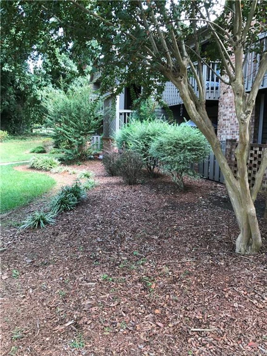 Location, location, location!  Ground floor condominium with dual masters.  Brand new carpeting.  Freshly painted interior.  New stove, range hood and refrigerator.  New horizontal blinds.  Numerous other updates & super clean!  This unit has a great floor plan, including a wood burning fireplace w/brick hearth, split floor plan w/separate private patios, & an outside attached storage room in the back.  Lake Wylie Woods has a swimming pool on site for residents and a dock for Lake Wylie access.