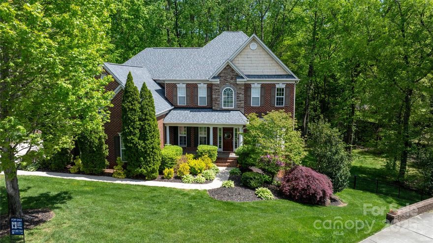 Welcome home to this simply stunning and blissful backyard oasis, complete with a new composite deck with a screened-in porch, brick patio and a fireplace. Step inside to discover 6 beautifully appointed bedrooms, 4.5 baths, and a serene main-level primary suite with floor-to-ceiling windows framing a stunning backyard view.  Soaring ceilings, custom built-ins, and a spacious kitchen make entertaining a breeze. Upstairs boasts a sixth bedroom/flex space and a large bonus room ideal for work, play, or storage. The finished basement includes a kitchen, bedroom, & bath—perfect for guests or multigenerational living. Upgrades include: roof ('21), refinished hardwoods and new upstairs flooring ('22), Renewal by Andersen windows ('23), raised garden beds ('24), updated HVACs (3), and a new 75-gallon water heater. The fenced backyard is perfect for kids, pets, or relaxing evenings outdoors. The home is located in the highly desirable and well-managed Laurel Park Subdivision.