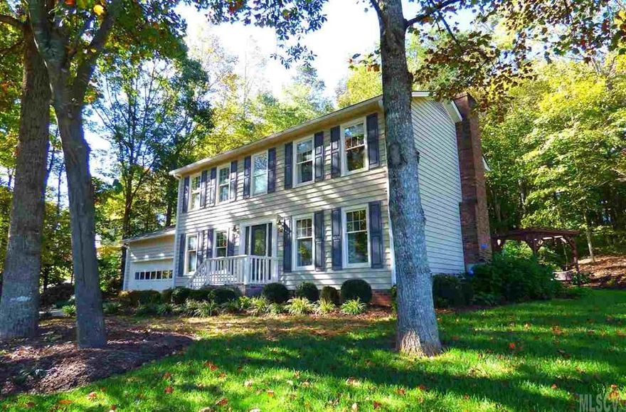 Updated family home in Northlakes that's ready for its new owner! Located on a 0.51 acre corner lot, this spacious home features a private, tree-lined backyard with patio, waterfall, and storage building! Inside, you'll find a central foyer opening onto both a formal living room and formal dining room/home office with a wall of built-in shelving. The back of the house features a cozy den with gas log fireplace, doors to the rear deck, & adjoining kitchen with sunny eating area, double pantry, granite countertops, and updated appliances. A full bath, craft room, laundry, and double garage complete the main level. Upstairs, you'll find three bedrooms & a bonus room, including a master suite with remodeled bath and walk-in tiled shower. Extras include replaced roof (2013), heat pump (2013), hardwood floors, tile, and loads of stylish updates. Voluntary HOA includes access to neighborhood boat launch & beach spot, basketball court, tennis court, & picnic/grilling area. No city taxes!