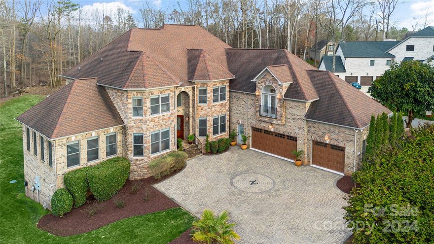 Grand Luxury Estate on 1.06 acres w/custom paver governors driveway, brick columns w/lights, landscaping lighting, 2 Juliet balconies, 4 car garage (1 garage in basement), epoxy floors, full brick w/stone accents. Backyard is ready for your lifestyle creation. Large deck off sunroom. Bedroom/bath on main level, w/2 story great room w/stone f/p & coffer ceiling, sunroom, open kitchen with octagon island, formal DR/LR, butlers station off DR & huge music room, office. Upstairs Primary suite w/sitting room w/stone f/p & Vaulted ceiling, Huge Second Primary suite w/sitting room. Each secondary bedroom has private bath & walk-in closets. Basement w/entertainment bar, huge rec room tile floors, billiards area, exercise room, secondary Laundry room w/storage, True Movie theater, Bedroom/bath & private entrance & private garage could be used as a second living quarters. Two patio areas. Heavy moldings and Central Vac. All the custom finishes on this beauty. This home won't disappoint!