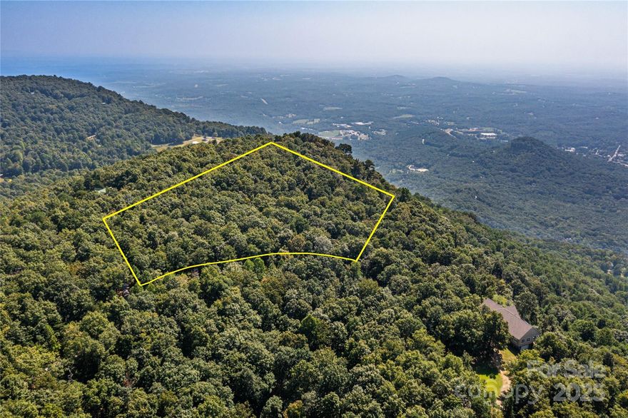3-lots combine to create a unique development opportunity with mountain views atop White Oak Mountain. This property slopes upward from front to back, creating an opportunity for stunning views from the proposed home site. The sellers have started the process of obtaining a septic permit and the lot has access to a community well already in place. The Camp Skyuka neighborhood once hosted a summer camp that has since been transformed into a haven of rest, relaxation, and adventure for a new generation of outdoor enthusiasts. Enjoy community amenities including a small lake with multiple swimming docks, tennis courts, and tranquil mountain views. A builder familiar with the lot is available for consultation and can review the sellers' previous house plans with any interested buyer.