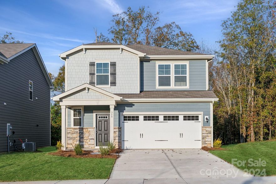 Welcome to the Rowan Floorplan, a beautifully designed two-story home offering 1889 square feet of modern elegance and comfort. As you step inside, you're greeted by an open floorplan that seamlessly connects the living spaces, perfect for both everyday living and entertaining. On the main level, the heart of the home is the kitchen, featuring sleek quartz countertops and a spacious island that provides ample space for cooking and gathering. Adjacent to the kitchen is the great room, where an electric fireplace serves as a cozy focal point. The downstairs also includes a convenient powder room and access to a generous two-car garage. Ascending to the upper floor, you’ll find four spacious bedrooms. The highlight is the primary bedroom, a tranquil retreat that boasts its own in-suite bathroom, which leads to a large walk-in closet, providing abundant storage space.