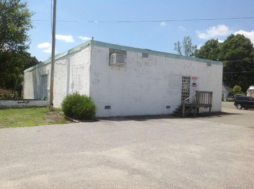 Building is located in downtown Cherryville area, city parking available, no bathroom, warehouse space, has been used for retail but no bathrooms are in the building, window unit air and space heaters (owner has not verified that they work and does not plan to replace), selling in "as is" condition, city water/sewer has not been selected since this property has none, however, it is in city of Cherryville on Main Street and water/sewer should be available
