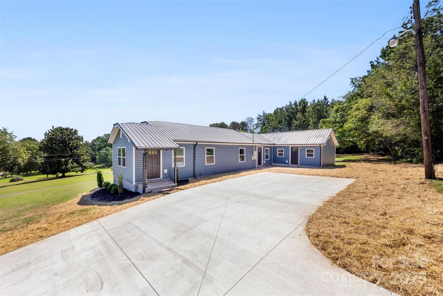 Welcome home to this beautifully renovated 3-bedroom, 2-bathroom home offering over 1,800 sq ft of comfortable living space on more than half an acre. You'll  love the open floor plan filled with natural light and the thoughtful split-bedroom design that gives everyone their own space. The living room features an electric fireplace that adds the perfect touch of warmth, while the open flow makes it easy to gather with family and friends. The primary suite is truly a retreat, complete with a walk-in closet accented by barn doors and double doors leading out to a private deck where you can sip your morning coffee. The spa-inspired bathroom feels like your own personal getaway with double vanities, a large tiled walk-in shower, a soaking tub, and a private water closet. You’ll also love the convenience of having the laundry room right in the suite. The other bedrooms are spacious and inviting, each with easy access to a beautifully updated bathroom. Every detail of this home has been carefully refreshed, from the updated finishes to the bright, welcoming spaces. Step outside and enjoy over half an acre of land—perfect for relaxing, entertaining, or creating the backyard you’ve always dreamed of. Back on the market due to no fault of the seller.