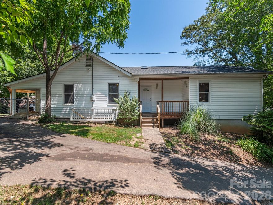 You'll love this move-in ready and charming West Asheville one-level home! The nicely updated 3BR/2BA home nests on 1/3 acre in a quiet, established neighborhood—just minutes to downtown, dining, and shopping. It offers split floor plan, tons of nature light, recently installed/refinished wood floors, and fresh paint throughout. Step into the foyer with vaulted ceiling and skylights, a stylish French door opens to the large primary suite with spacious laundry room and walk-in closet, and a big bathroom with skylight, new shower and new fixtures. On the other side, open living room and dinning room connects with a full bath and 2 guest bedrooms. The kitchen offers ample cabinet space, lush views, and newer appliances: GE energy efficient range (arriving 7/1/25), fridge and disposal (2024), and Whirlpool dishwasher (2020). Covered front and back porches, a large fenced back and side yard with mature trees, offer great outdoor space for gardening and play. Central HVAC (2019).