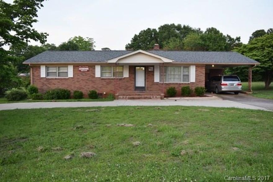 This all brick ranch has a circular driveway and attached carport.  Lovely home offers beautiful hardwoods and tons of living space. Formal dining room, large living room, and spacious kitchen is equipped with built in microwave, electric cooktop.  Very big backyard and storage shed. Great residential property that is also zoned commercial and currently being used as an alterations shop. Convenient access to main highways for easy commute. Nearby shopping and dining. #Commercial MLS 3287331.