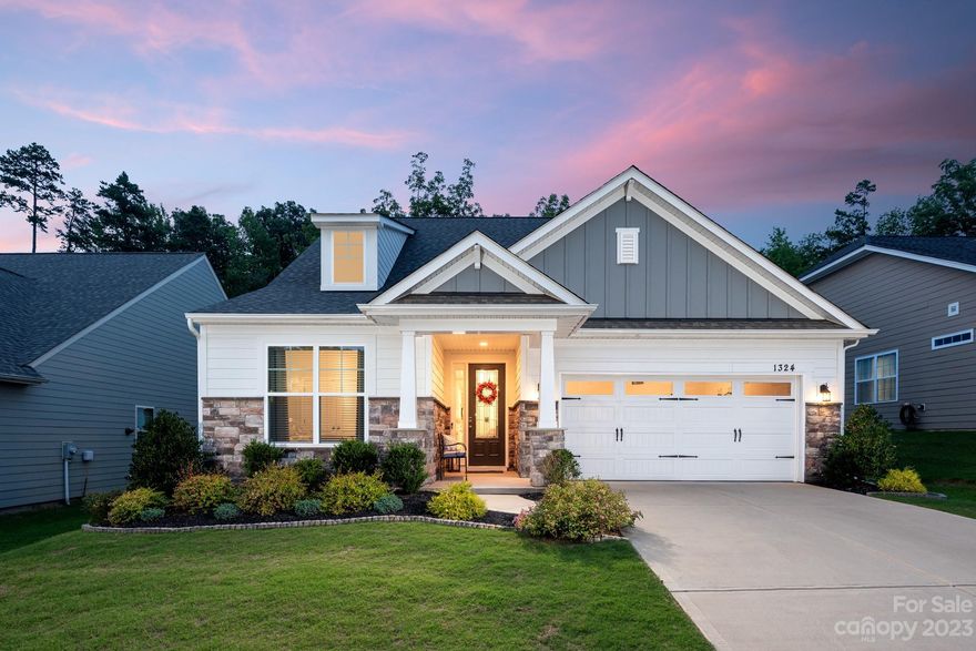 Imagine a two-bedroom, two-bath home with 1,759 square feet of space in a neighborhood with pocket parks, walking trails, garden areas and a spectacular 7,000-square-foot amenity center. Welcome to Heritage South, a sought-after 55+ neighborhood. The home, built in 2019, boasts a gourmet kitchen with a granite countertop island, gas cooktop, wall oven and microwave. The spacious main bedroom leads to a large bath and walk-in closet with laundry access. A designated office space comes with French doors, and a glass-paneled sun porch is where you can enjoy North Carolina seasons. Outside, a paver rear patio and an epoxy-finished garage are quality flourishes. The community features gathering spaces such as a grand hall, kitchen, game room, and arts and crafts room. A pool, cabana, covered patio and outdoor bar add to the carefree living. A short drive to Crooked Creek Park connects you with a dog park, athletic fields, splash park, playground and picnic area. All this is waiting for you!