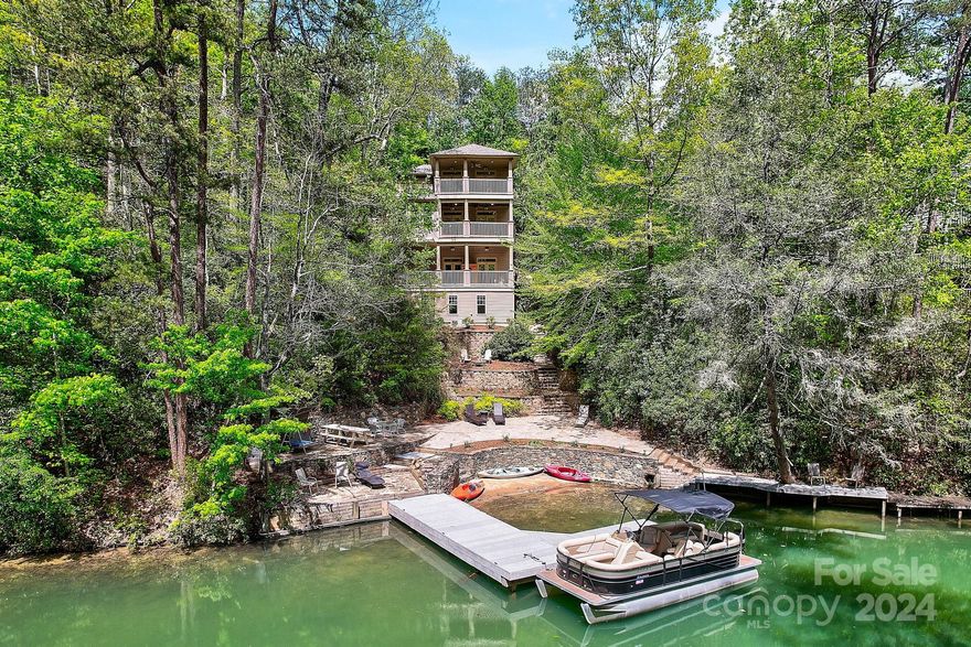 Fall in love with this incredible, fully furnished, LAKEFRONT HOME inside the gate of Rumbling Bald! Create those special memories with your own private swim area, boat dock, quiet cove, custom stonework gathering areas, 3 fire pits, movie wall and special touches scattered throughout. This lake life, dream home also features,5 en-suite bedrooms, large open kitchen, formal dining area, living room with fireplace and multiple lakefront balconies making it that much sweeter for when it is time to bring it all inside. The mid-point from lake to home, temp controlled flex-space features a full bath and is the place for kids of all ages to play games, read a book, watch the rain or store your lake toys. Level parking to main and all just a short golf cart/paddleboard/kayak or boat ride from all the amenities! With over $70K in upcoming rentals booked and more to come makes this a solid, turnkey, business opportunity. Don't miss out on this lakefront gem! On LL Map #30 Laurel Landing Cove!