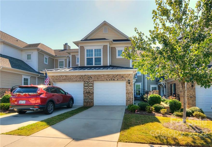 Welcome home to this lovely Creekwood model carriage home featuring spacious living in an open concept! Home features a split bedroom plan, separate office with French doors, dining area with crown molding and wainscoting, and great room with gas log fireplace for the cooler seasons.  Kitchen offers SS appliances with gas range, quartz countertops with marble backsplash, pantry, & a breakfast nook with lots of natural light. Primary suite features carpet, dual sink vanity, walk in shower plus a separate garden soaking tub, and a spacious WIC. Enjoy relaxing on the screen porch overlooking the wooded back! Located near the front of the community with a short commute to shopping, dining, and many of the resort style amenities Sun City residents enjoy!