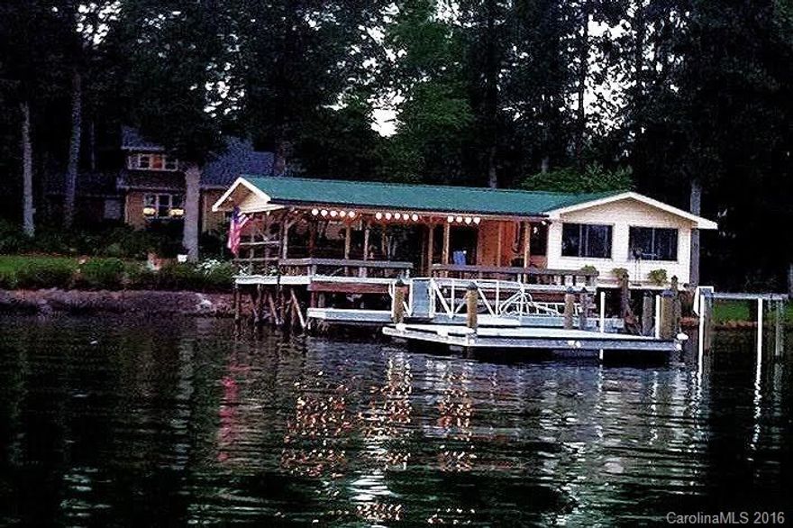 FANTASTIC Views of Lake!  You will see this home is well built, has been updated properly, and shows like a new home.  When entering the home you have a fantastic view of the lake and all the lovely garden areas.  There is a great entertaining area down by the lake with the enclosed Boat House, Dock and covered sitting area.  Sit on the covered dock and enjoy the breeze across the lake and the sunset.  See attached Special Feature sheet for all the features of this home.