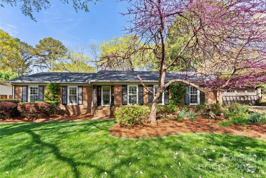 This beautifully updated 4-bedroom, 2.5-bathroom RANCH with 2 car GARAGE is the perfect blend of modern elegance and functionality. Bathed in NATURAL LIGHT throughout, the open-concept design creates a bright inviting atmosphere and features a beautiful kitchen with stunning marble countertops. A unique bonus room off the primary bedroom offers endless possibilities—ideal for an additional office space, exercise room, or cozy personal retreat. The dining area includes a charming fireplace, and the backyard is an entertainer's dream with landscape lighting creating a serene, magical atmosphere. Beautiful fixtures and hardwood floors throughout. Additional features include a whole house generator tankless water heater and a fenced backyard. New roof (2025) with blown-in insulation (2017). Located just minutes from Uptown Charlotte. This home offers the perfect combination of style, comfort, and convenience with close proximity to a green space and charming creek.  Welcome Home.